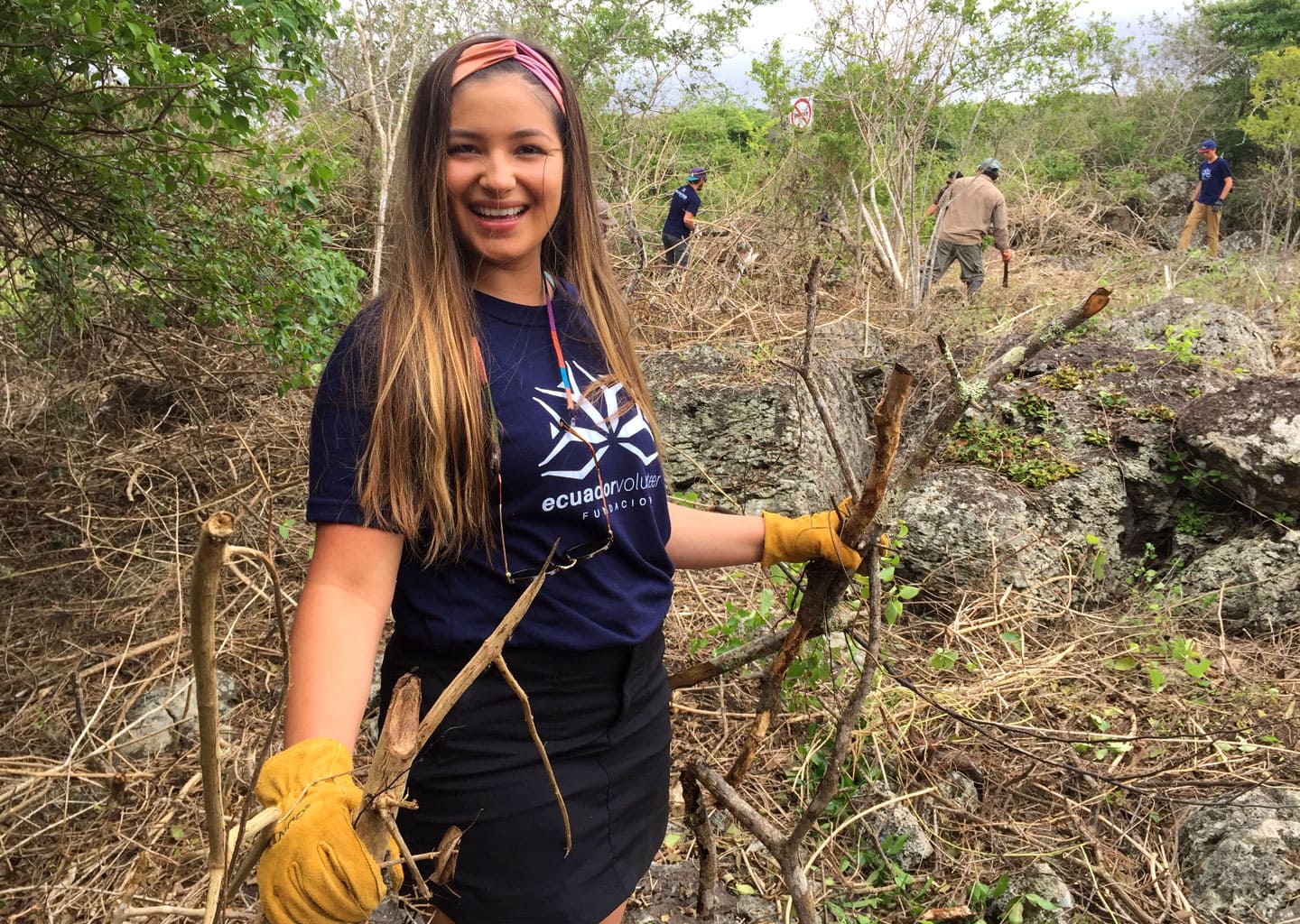 Erika cleaning the ground for planting endemic seeds.