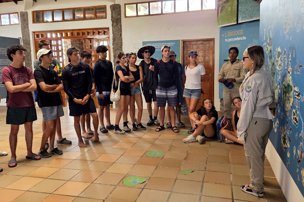 TEEN CAMP participants listening to safety guidelines from local coordinators