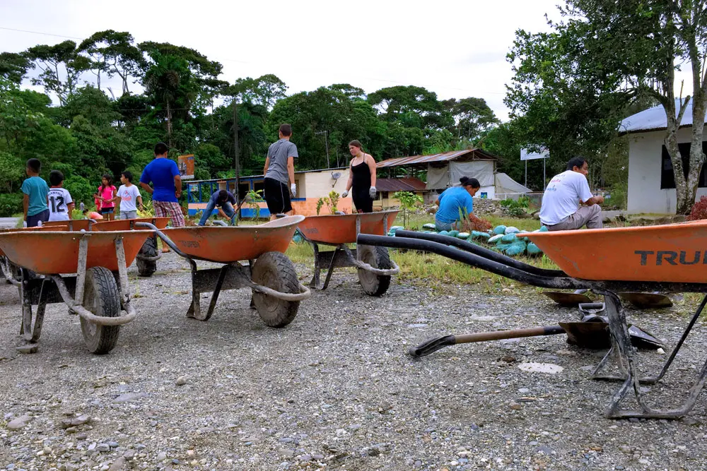 Teens participating in reforestation mission during camp in Ecuador