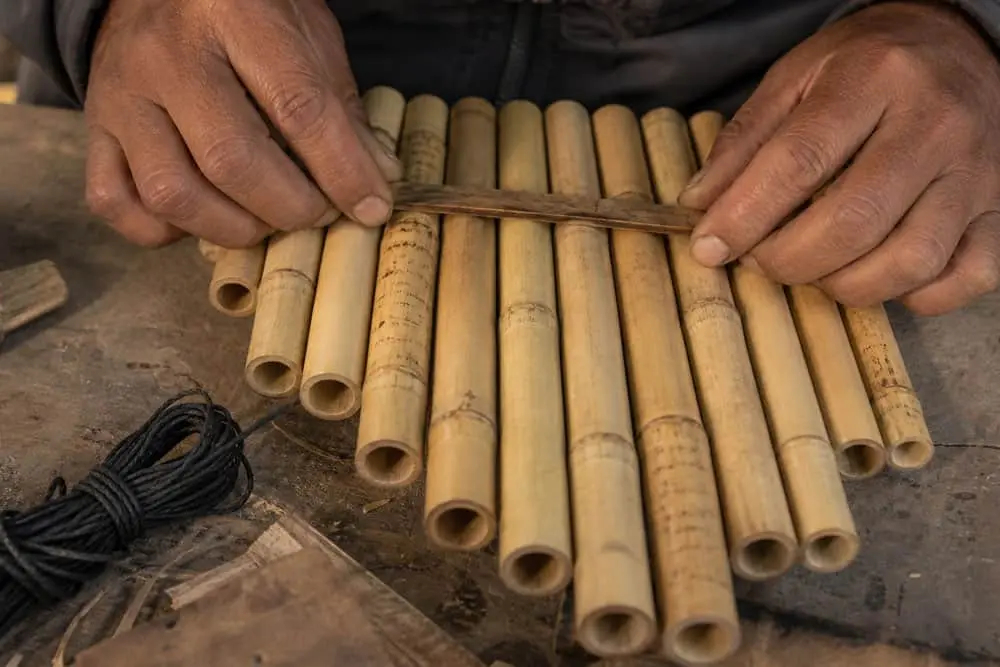 Traditional reed instrument handmade during a cultural activity in the Ecuadorian Andes